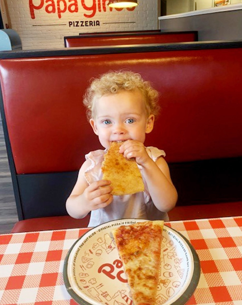 Child enjoying Papa Gino's pizza